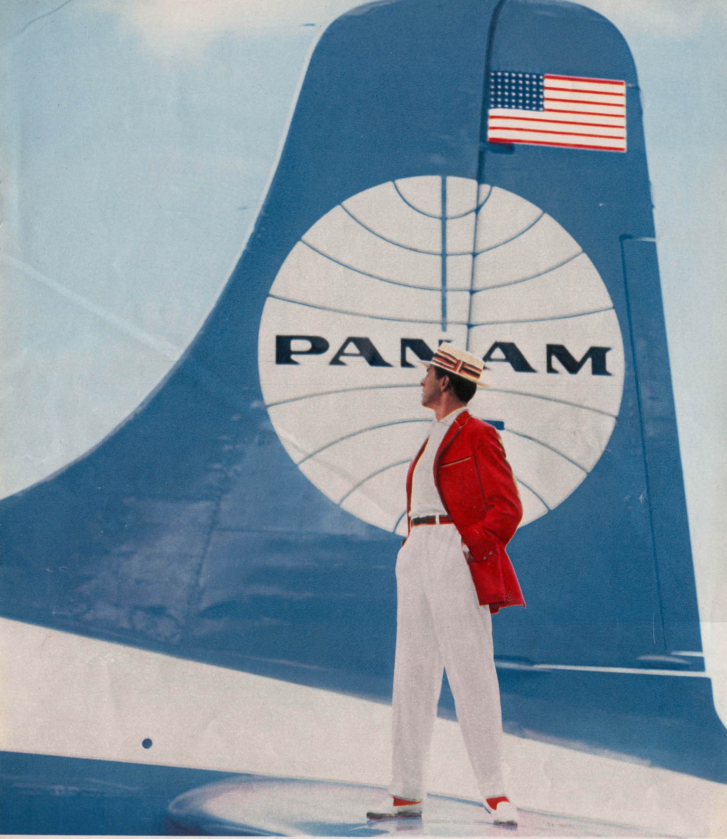 1950s Prior to adopting the blue ball with a white background Pan Am experimented with the reverse colors.  This picturew was taken from a men's clothing ad with the model standing on the tail of a Pan Am aircraft.